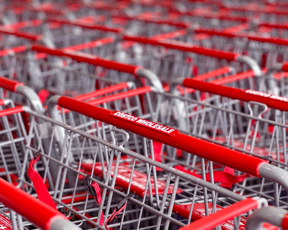 a row of red and silver shopping carts