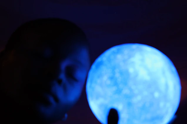 A serene illustration blending a human silhouette with celestial planets and a glowing spiritual aura.