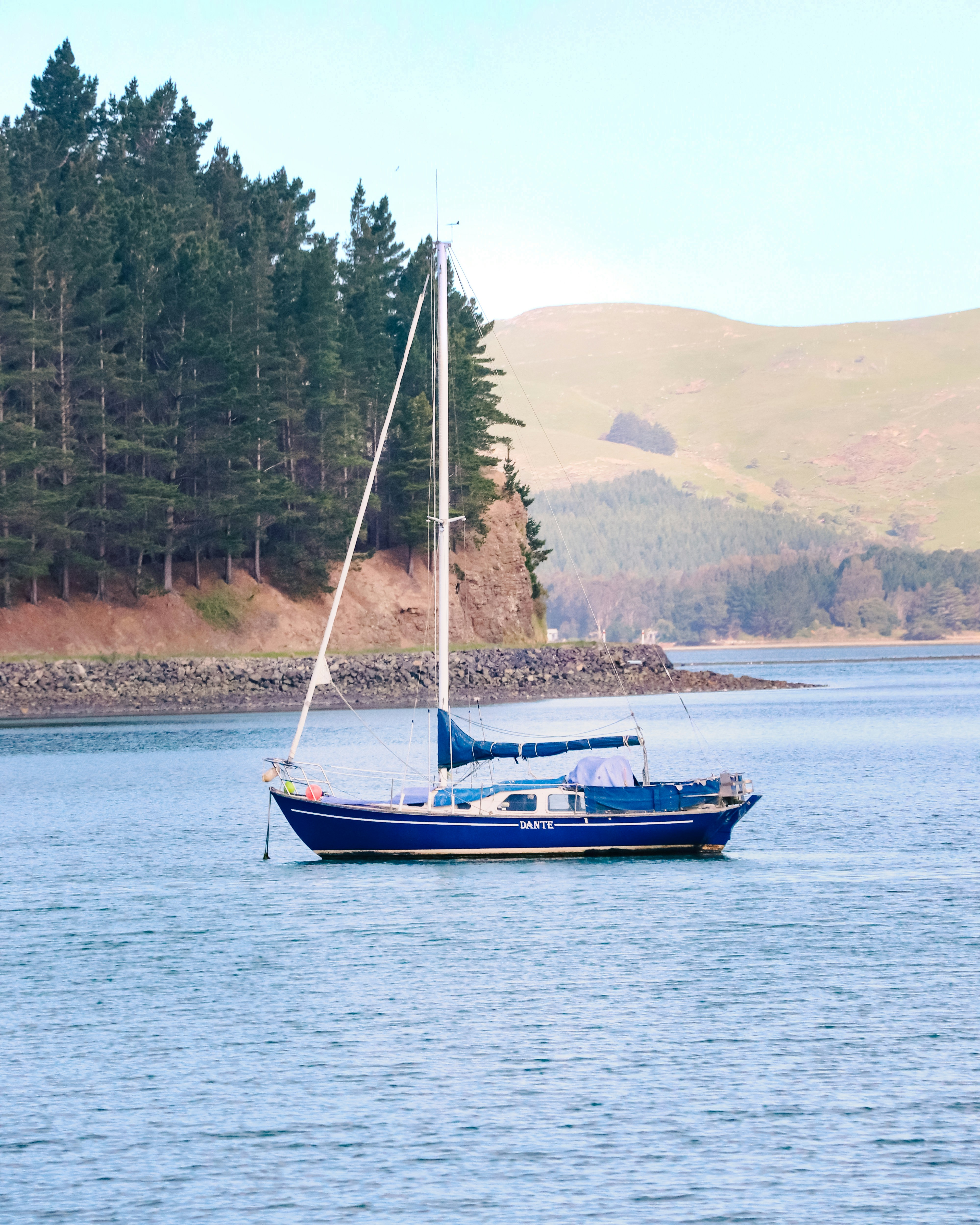 A sailboat in the middle of a body of water photo – Free Boat Image on ...