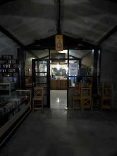 A cozy local business storefront with a 'redeem your coupon here' sign in the window