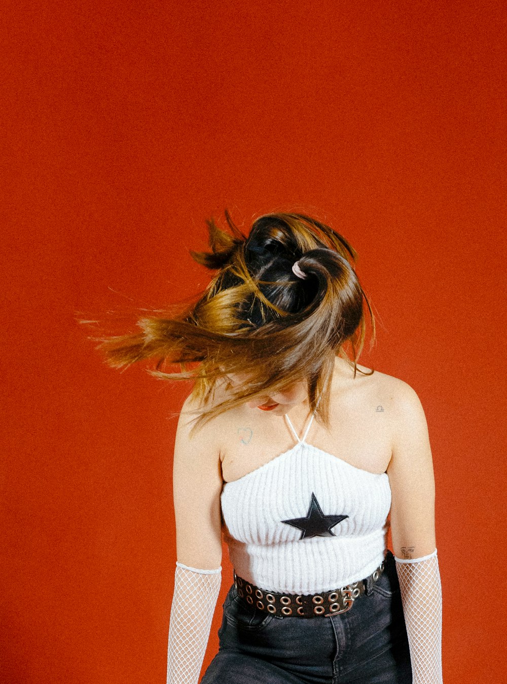 a woman with her hair flying in the air