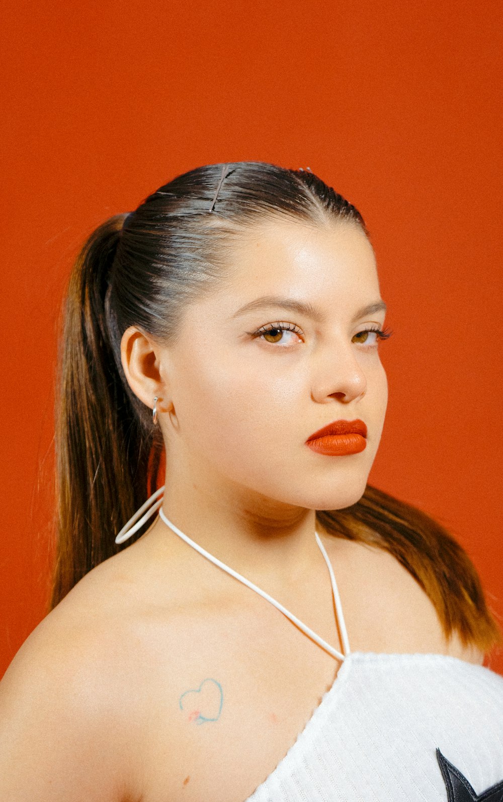 a woman with a cat earring on her neck