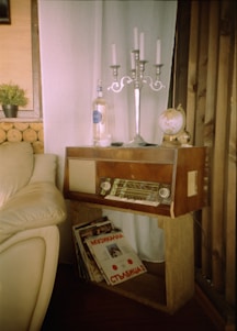 A cozy vintage radio surrounded by vinyl records in purple and silver lighting.