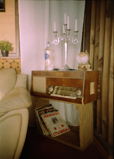 A cozy corner filled with vintage radios and classic vinyl records from the 1950s.