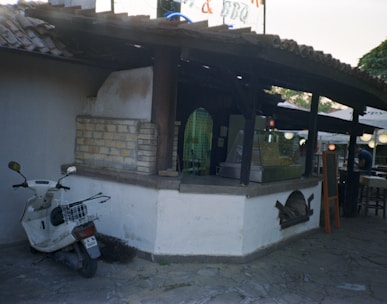 a scooter is parked outside of a restaurant