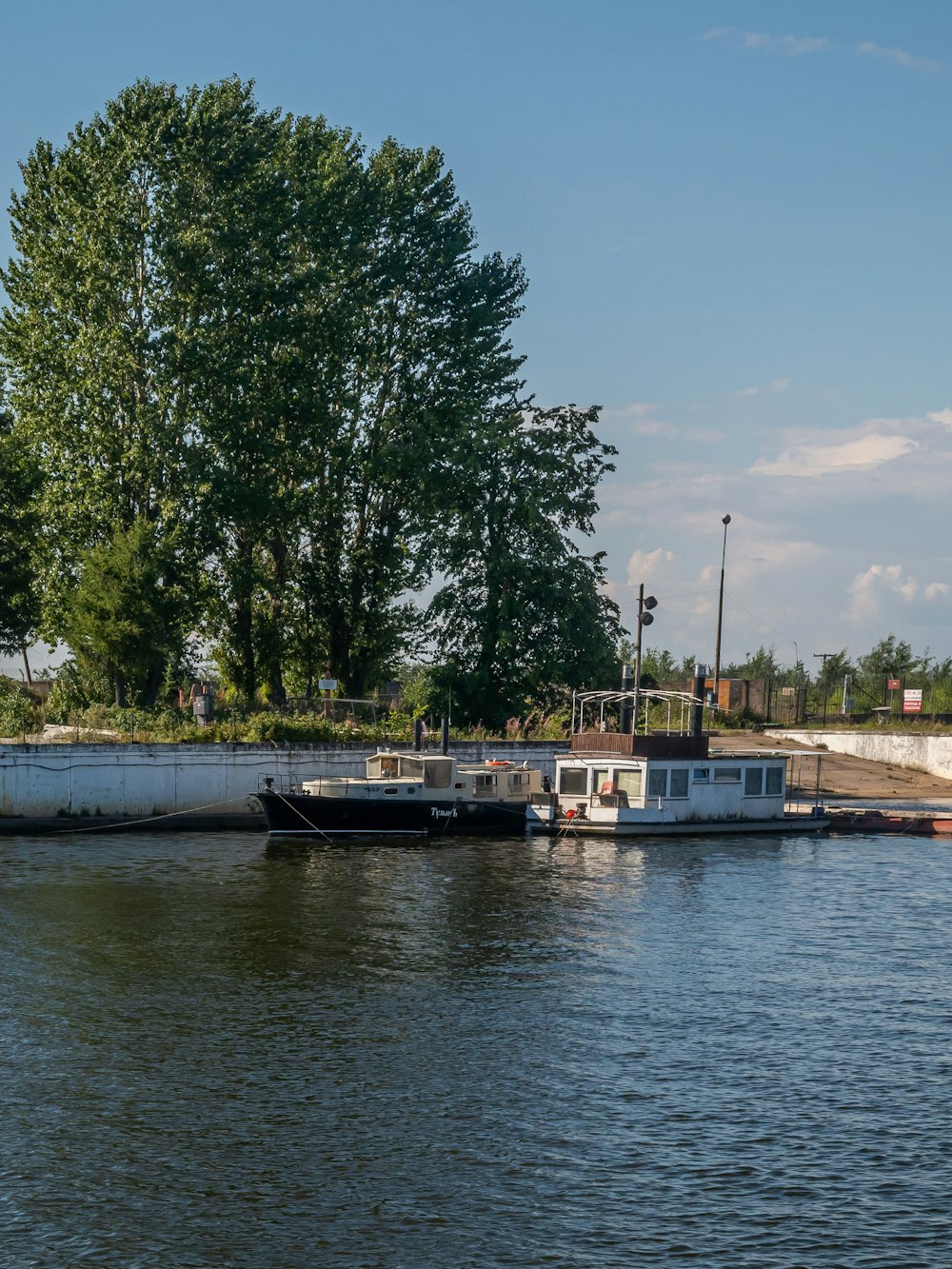 a couple of boats that are sitting in the water