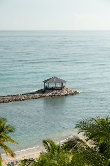 Montego Bay Caribbean tropical lagoon + all-inclusive resort corridor + Rose Hall + Hip Strip beach scene + palm trees + reef