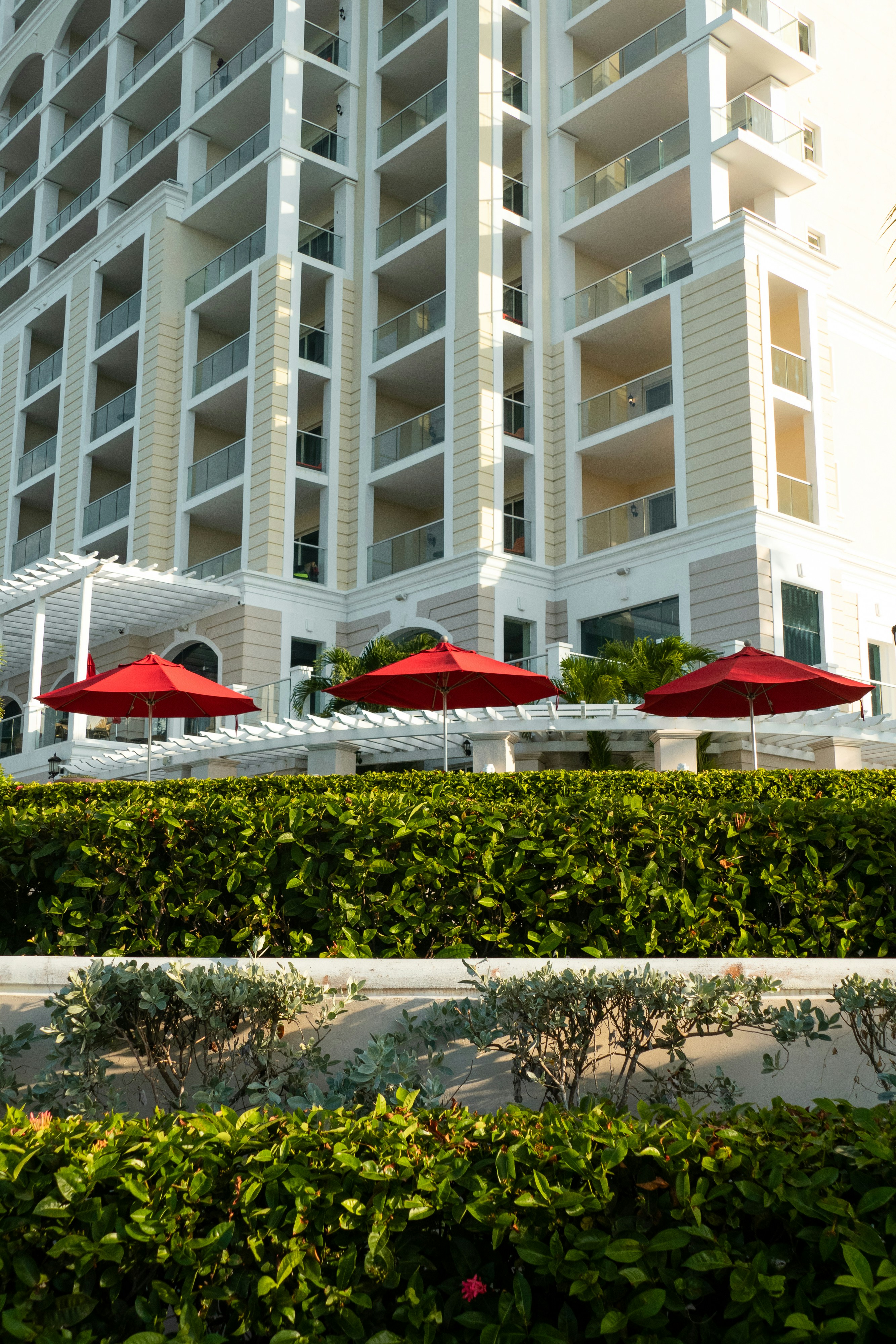 a building with a bunch of red umbrellas in front of it