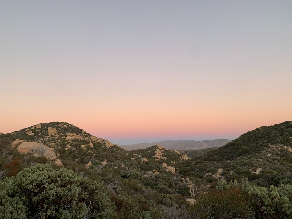 a view of a mountain range at sunset