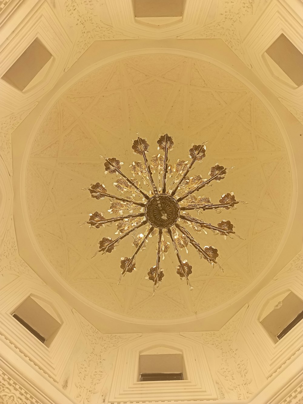 a chandelier hanging from the ceiling of a building