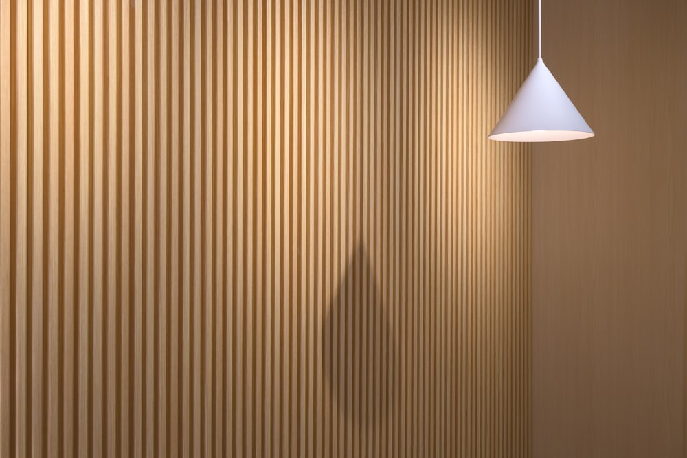 a lamp hanging from the side of a wall