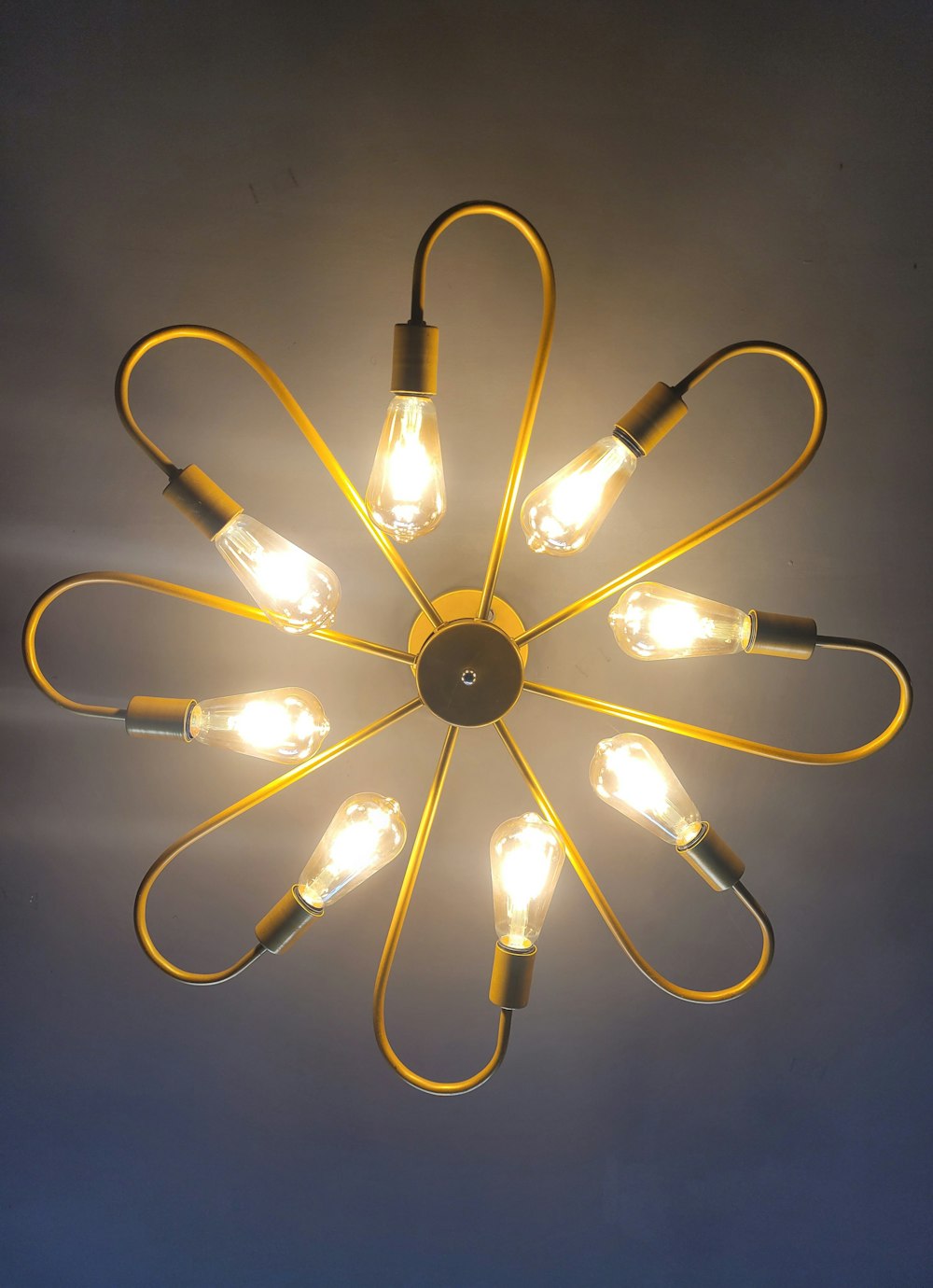 a circular light fixture with a bunch of lights on it