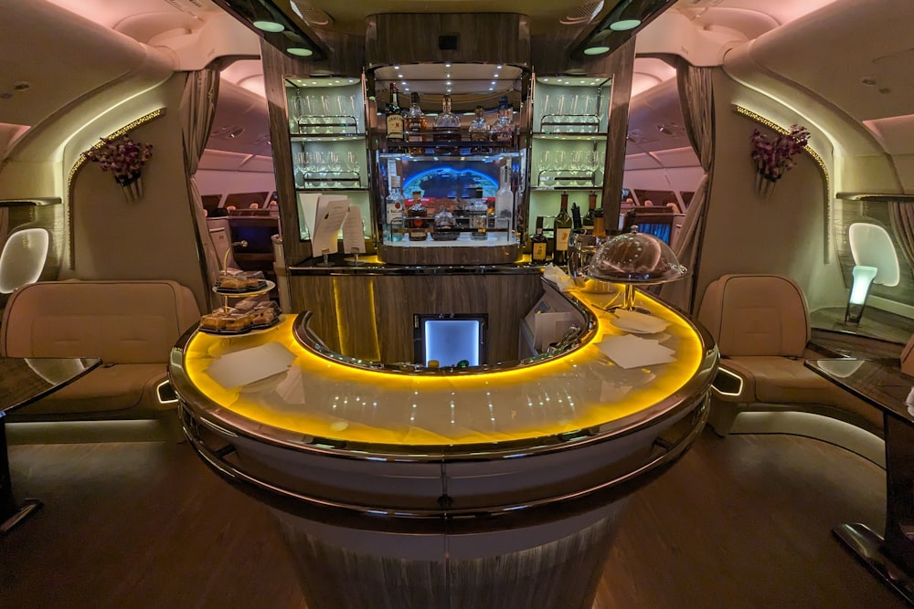 the inside of a private jet with a bar