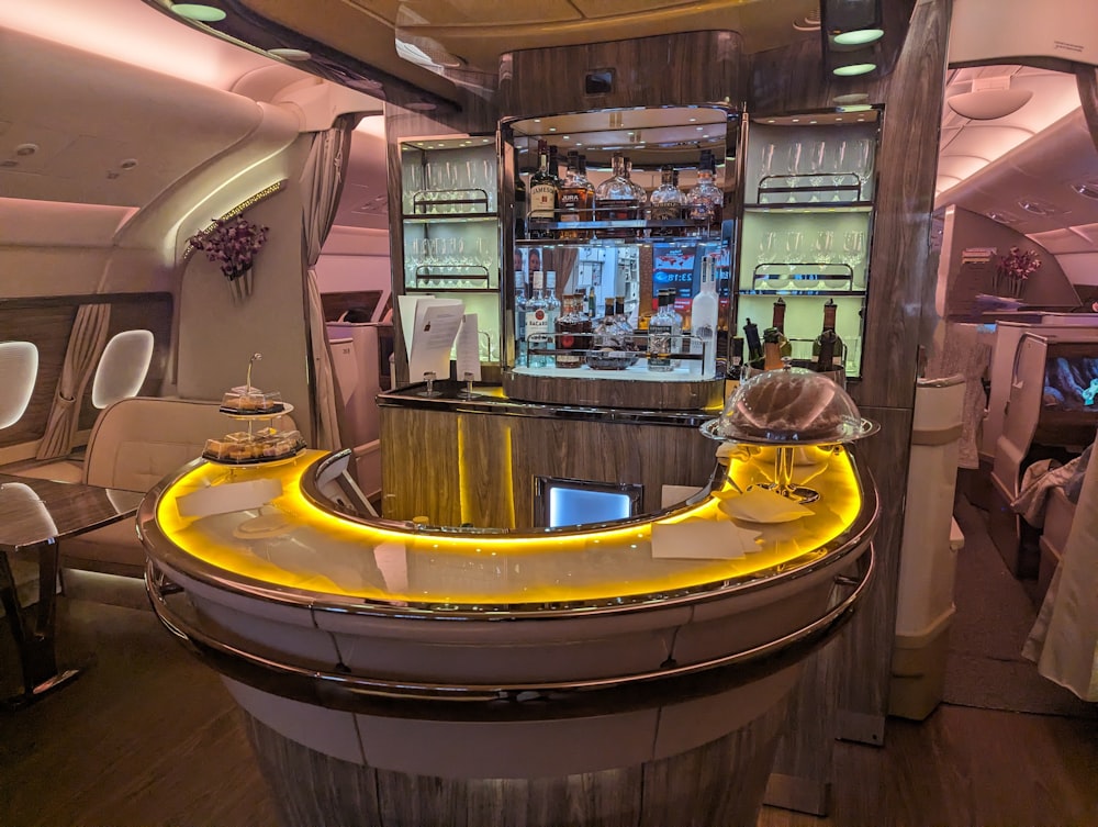 a bar inside of an airplane with chairs