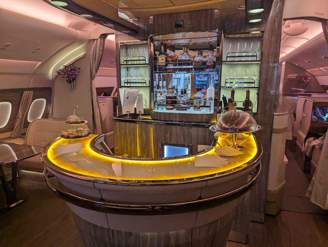 a bar inside of an airplane with chairs,