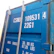 A close-up of a customized maritime container with branding details.