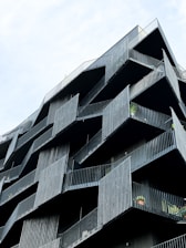 a very tall building with balconies on it