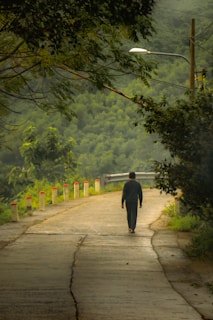 Paul reflecting quietly outdoors, symbolizing his journey toward healing.