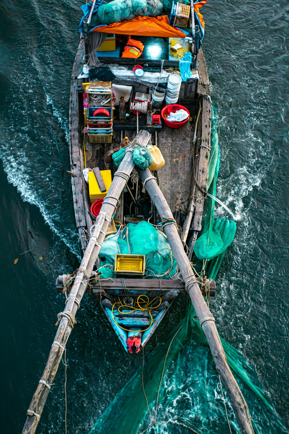 a small boat with a lot of stuff on it