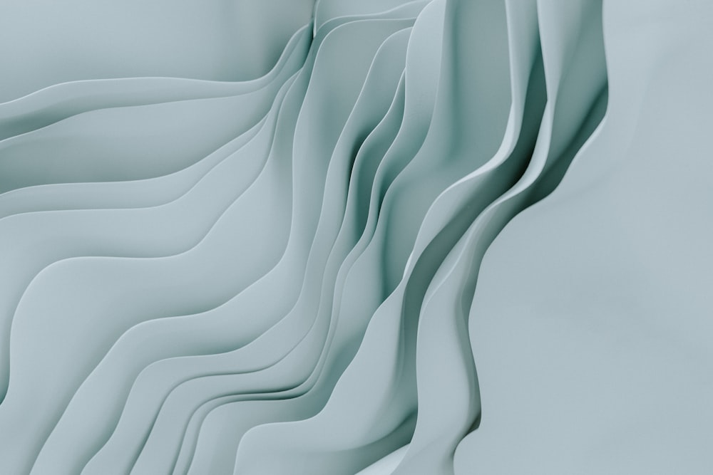 an abstract image of wavy lines on a light blue background