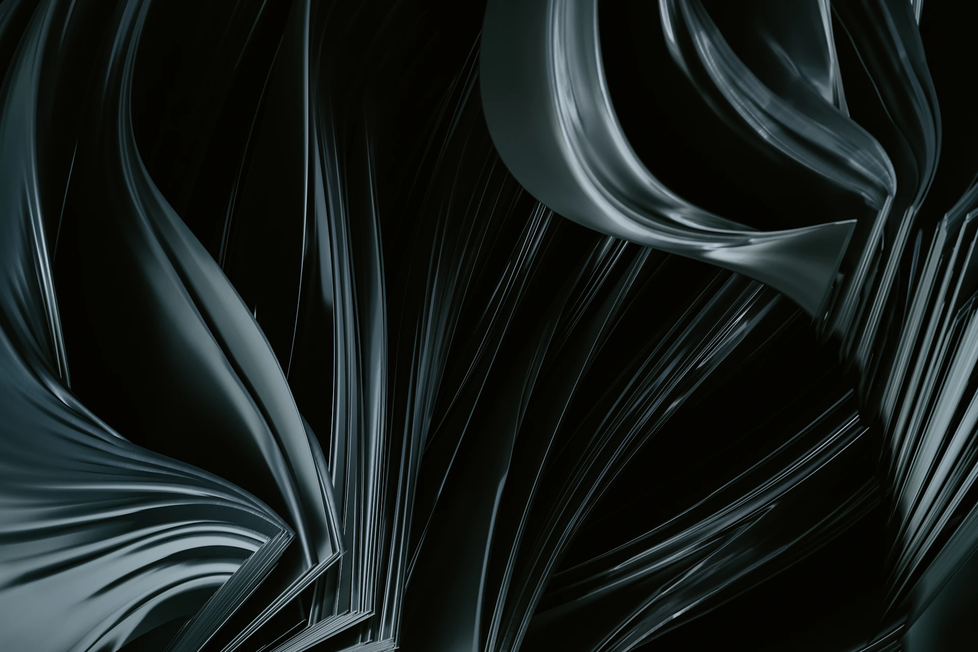 Abstract dark shapes gently shifting and flowing across a deep black canvas, evoking a sense of depth and motion.