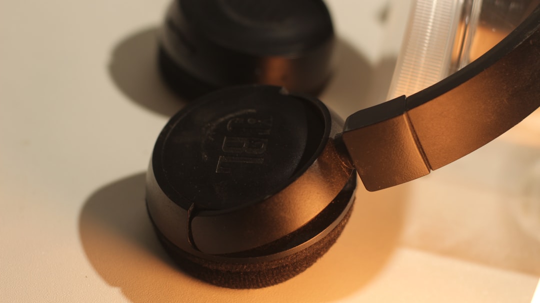 a pair of headphones sitting on top of a table,