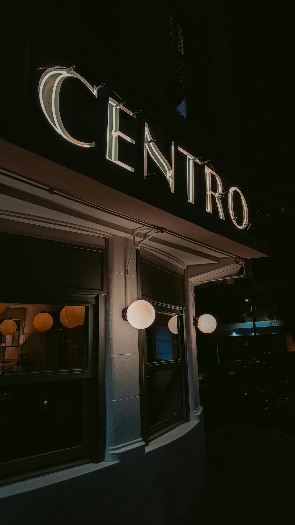a building with a sign that says centro lit up at night