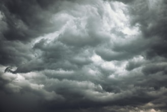 Dark storm clouds rolling in, signaling an approaching thunderstorm.