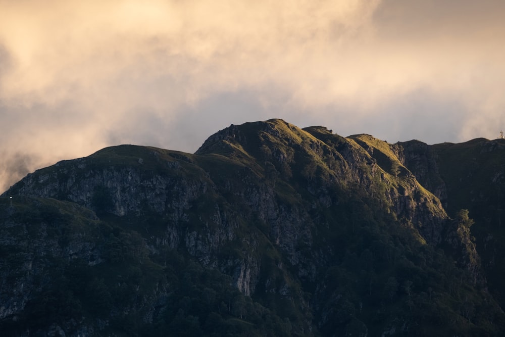 a mountain with a cross on top of it