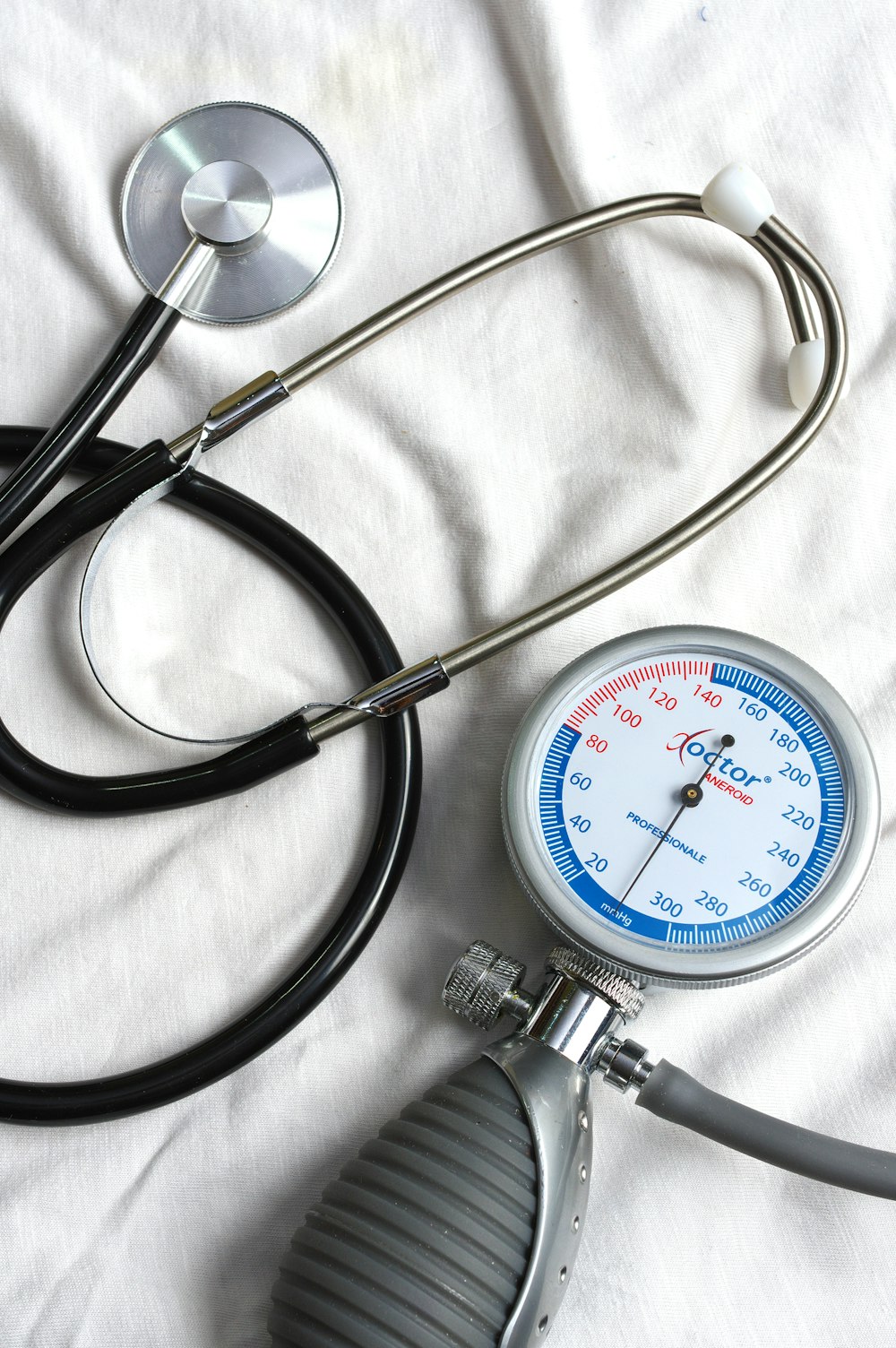 a stethoscope, a thermometer and a stethoscope