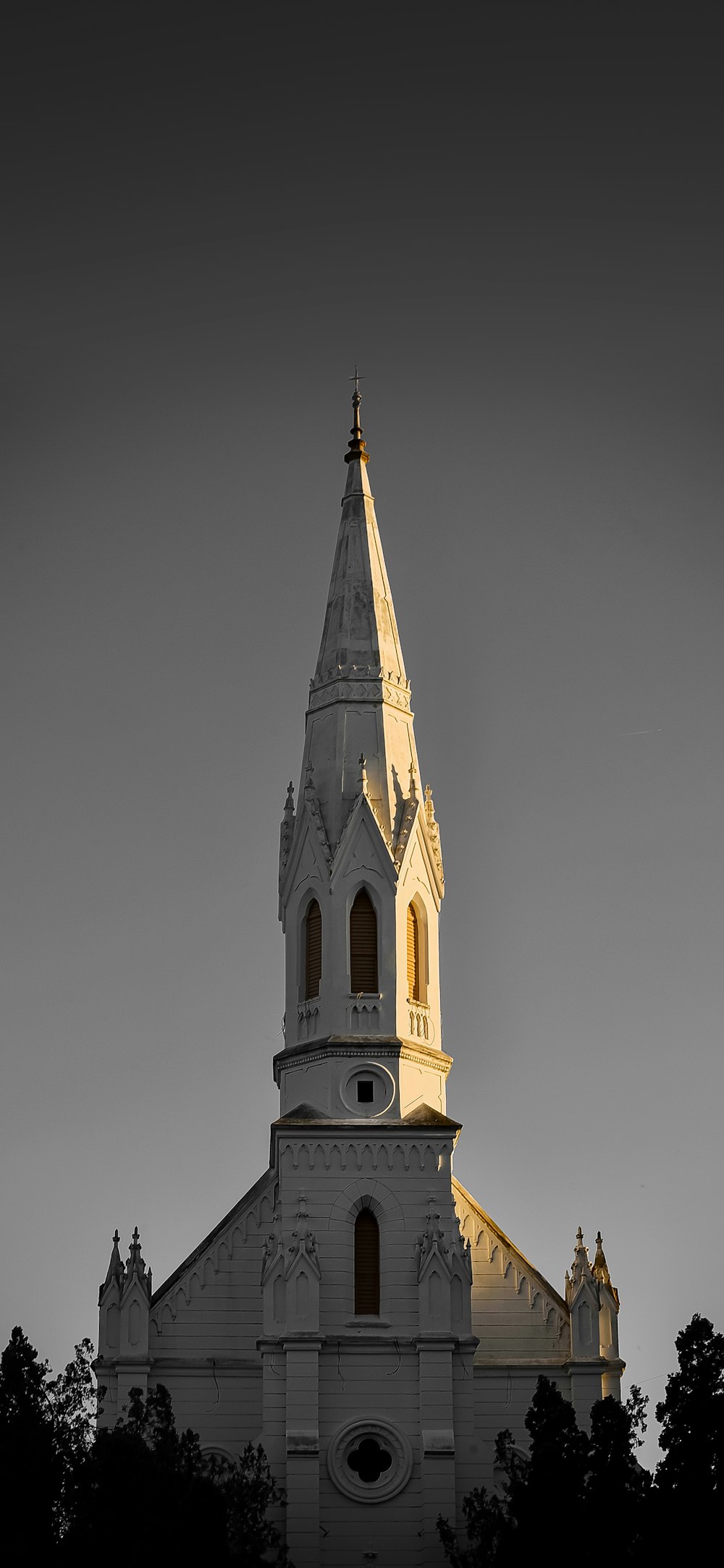 a church with a steeple and a clock on it