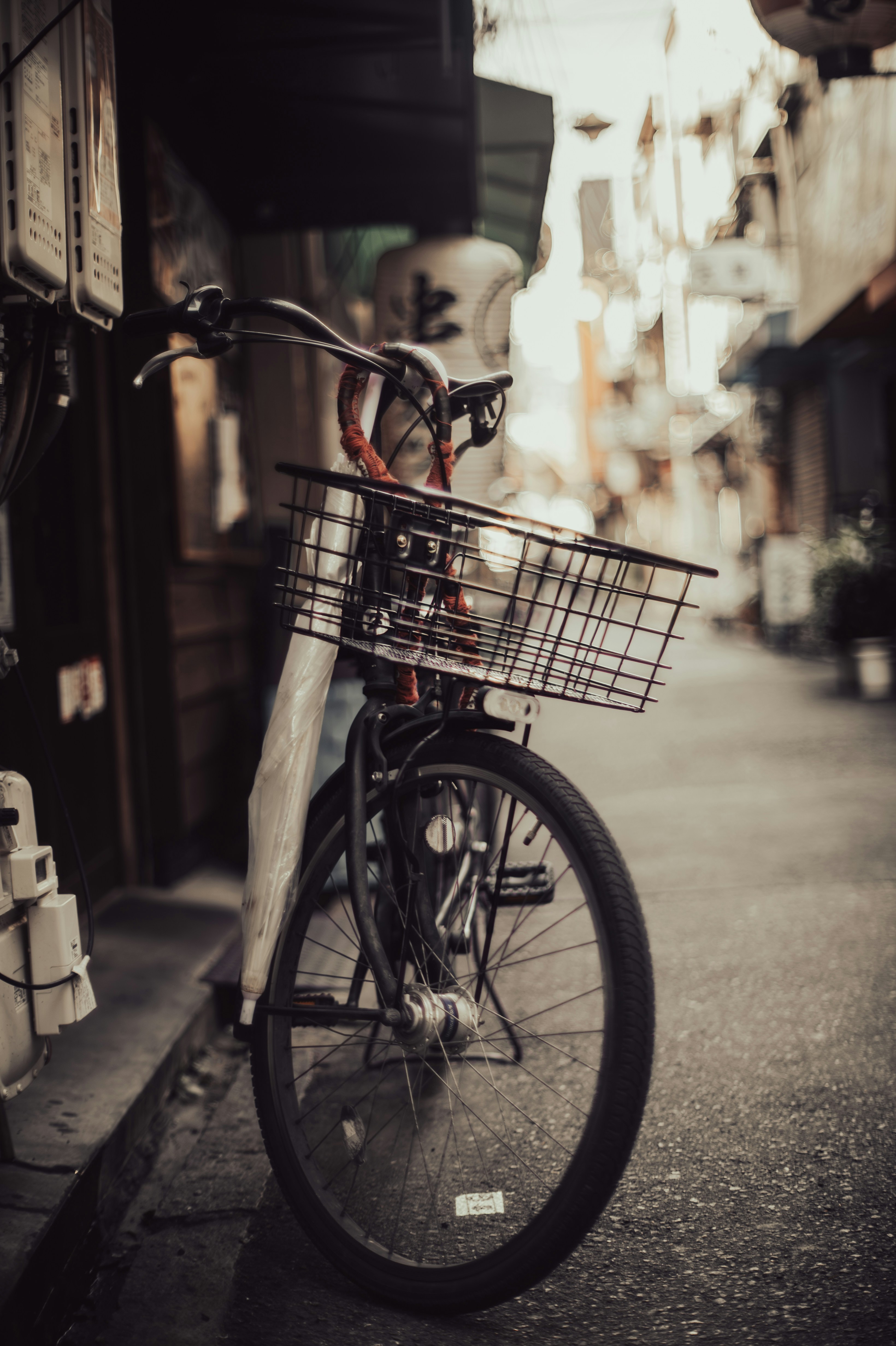 a bicycle parked on the side of a street