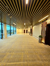 a large empty room with a lot of windows