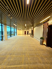 a large empty room with a lot of windows