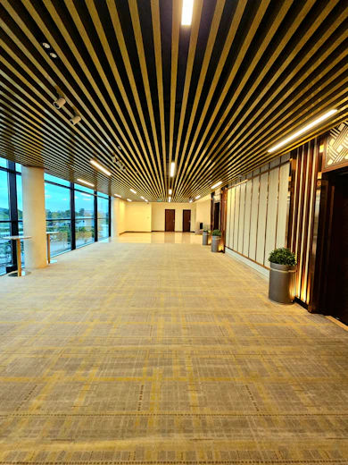 a large empty room with a lot of windows