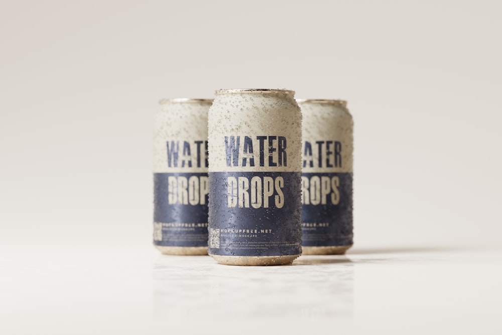 three bottles of water sitting on top of a table