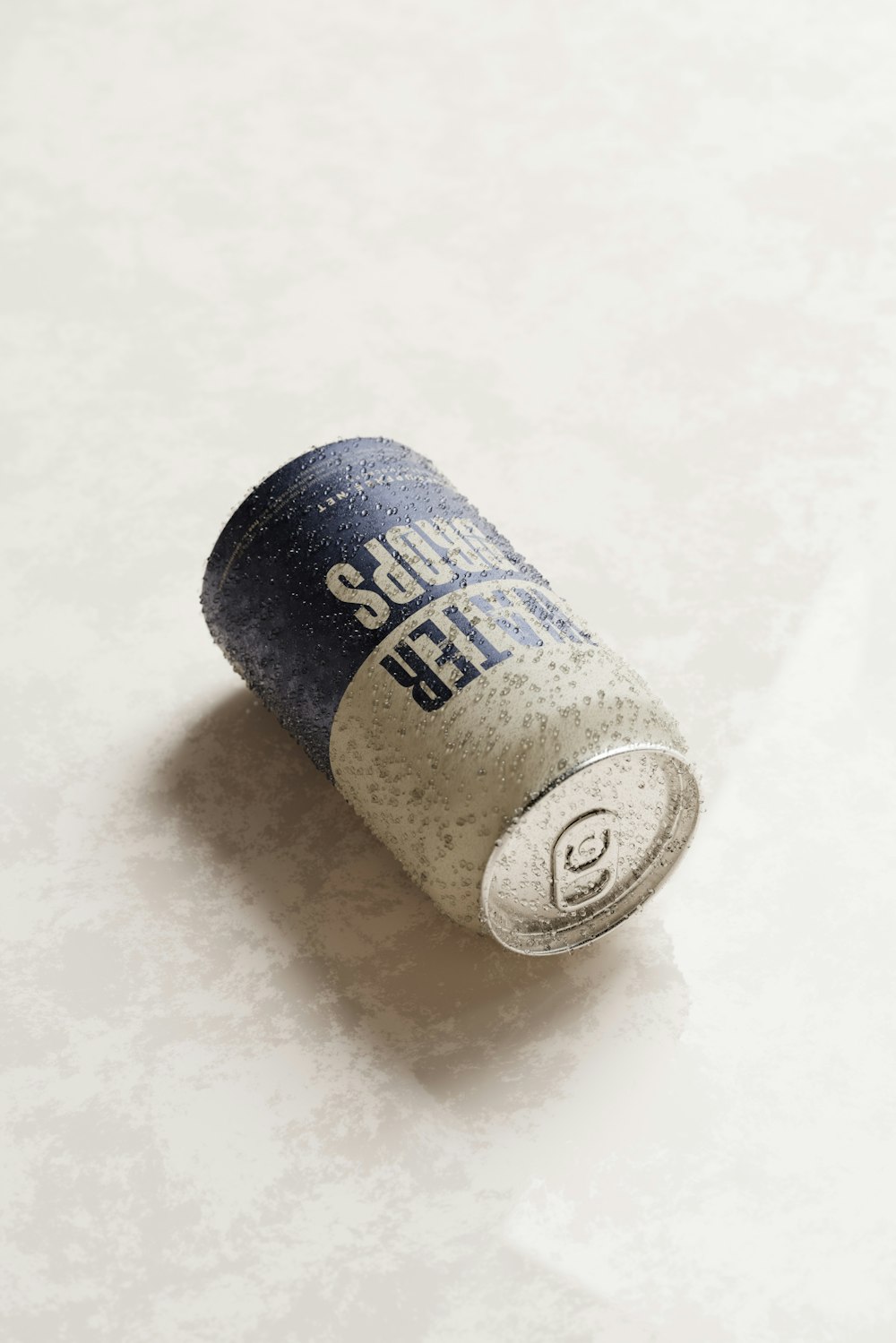 a can of soda sitting on top of a table