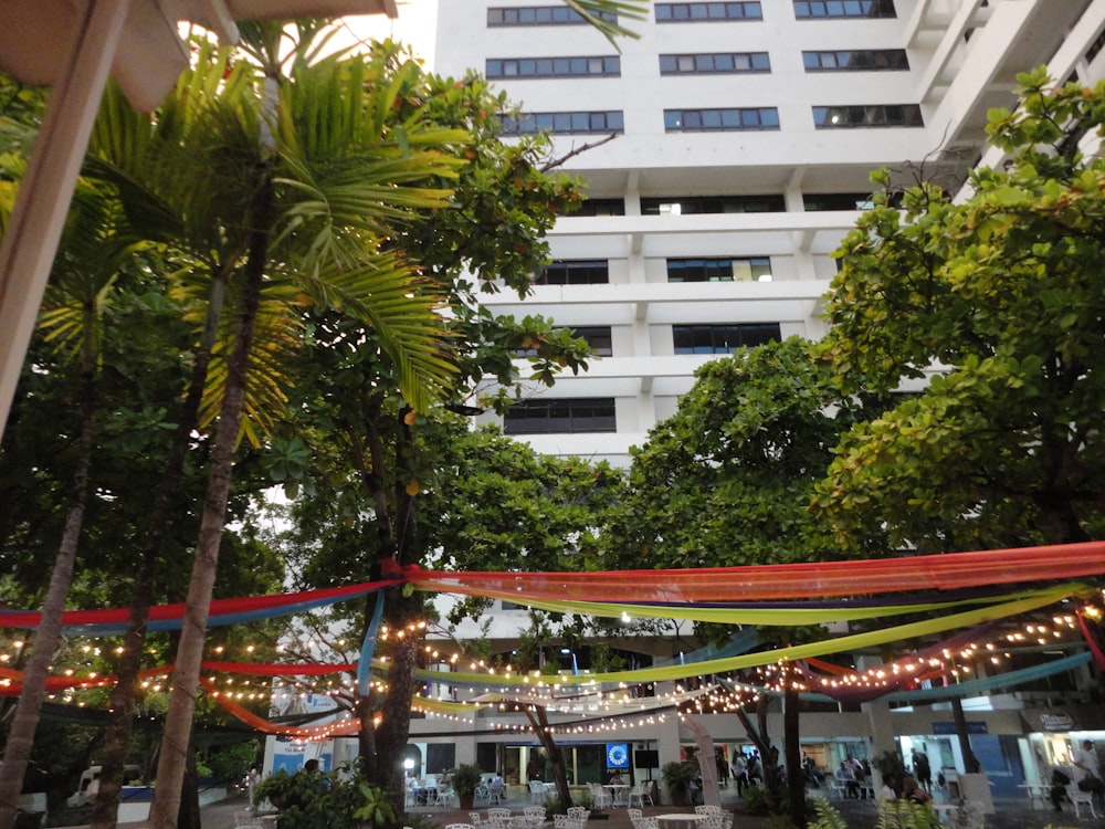 a group of people sitting at a table under a canopy