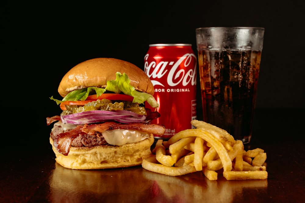 a hamburger and french fries are on a table