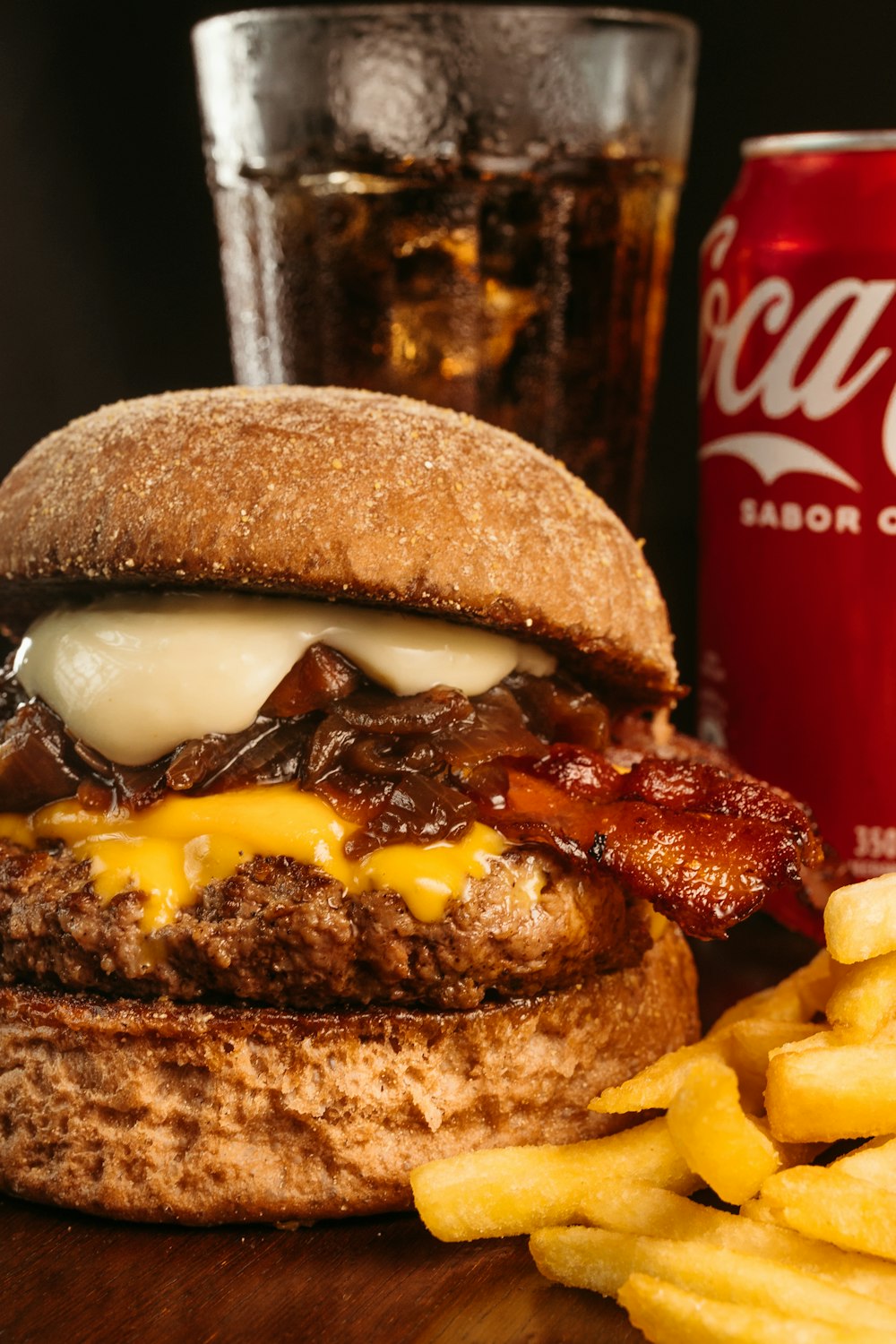 a bacon cheeseburger with fries and a coke