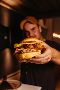 a man holding a large sandwich in his hands