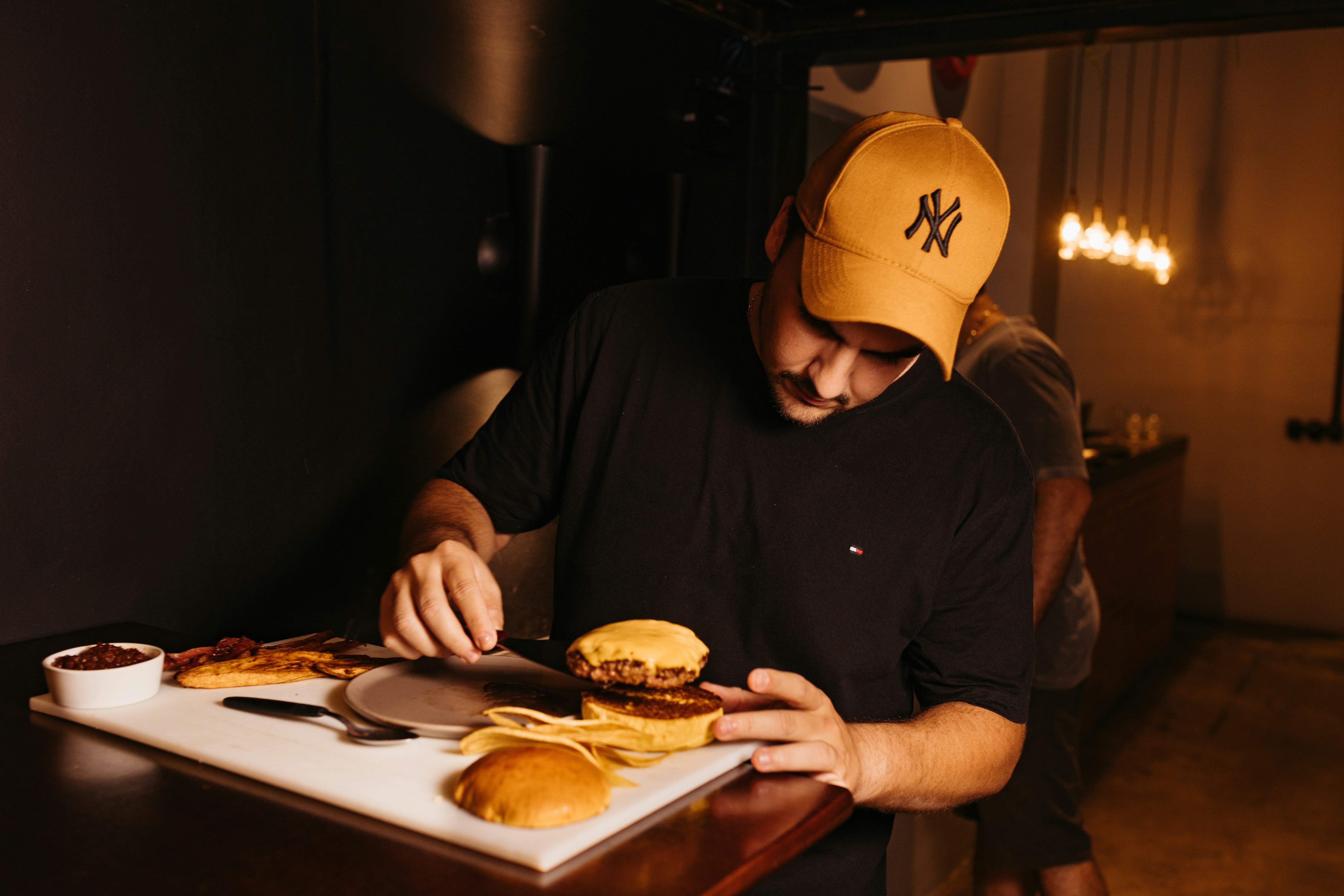 Man enjoying burger at table