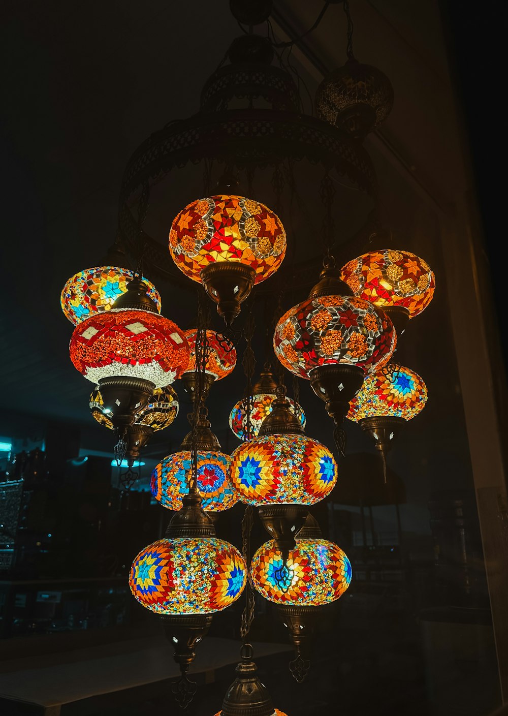 a chandelier with many colorful lights hanging from it