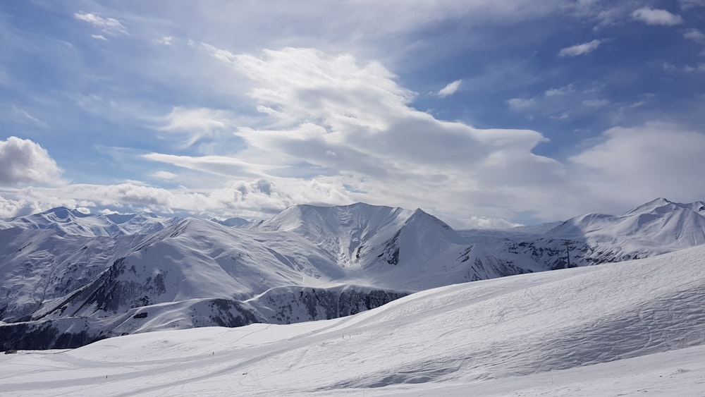 a person skiing down a snow covered mountain