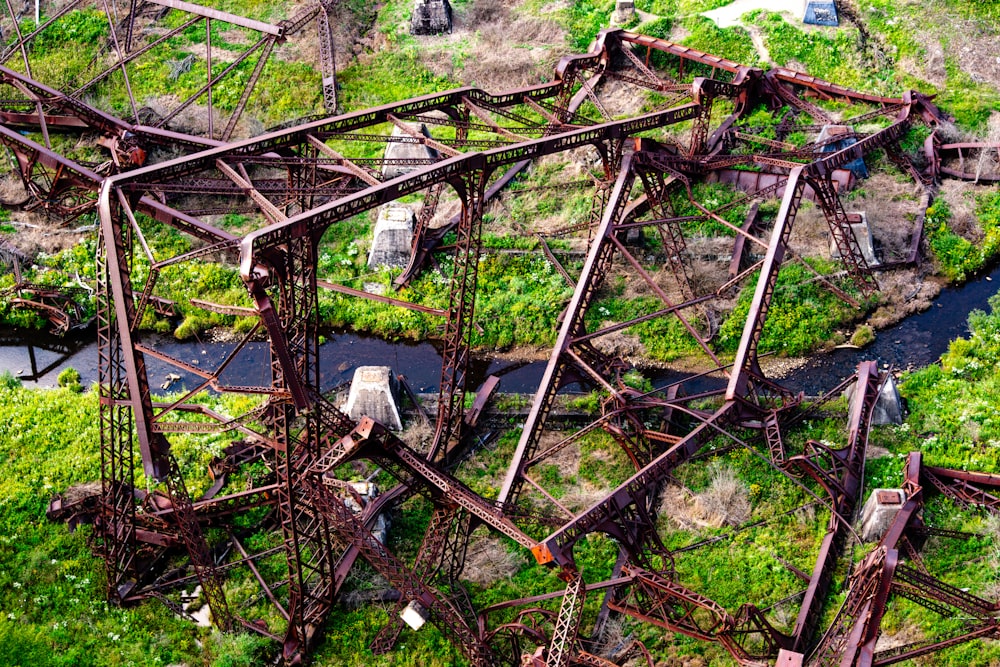 an aerial view of a train trestle in the woods