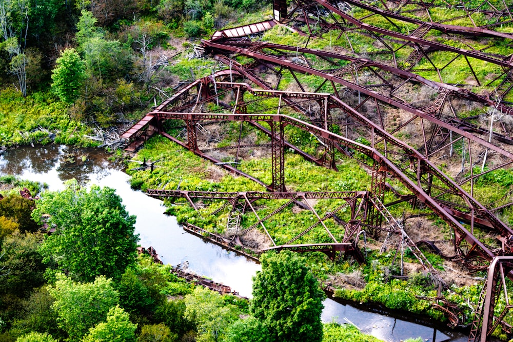 an aerial view of a train bridge over a river