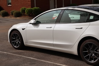 a white car parked in a parking lot