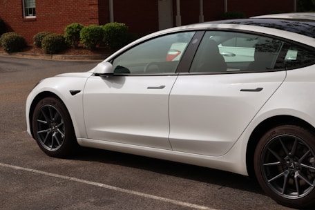 a white car parked in a parking lot