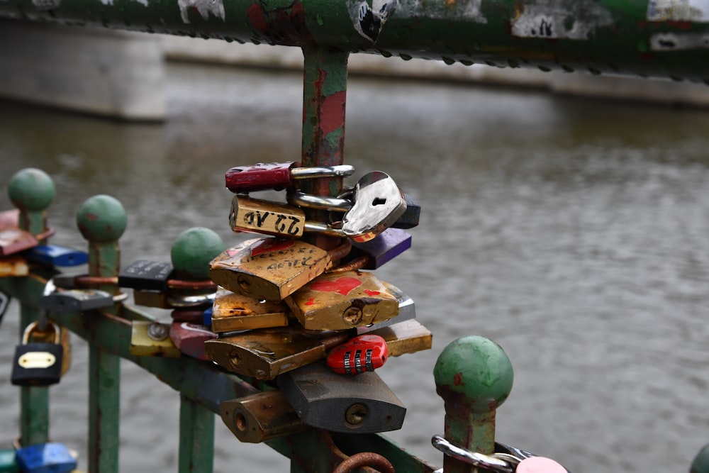 a bunch of locks are attached to a bridge