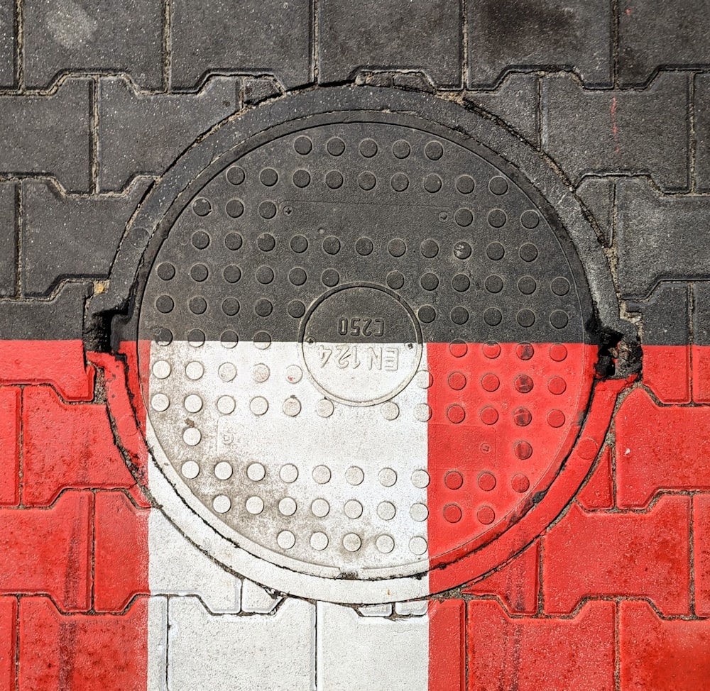 a fire hydrant cover painted red, white and black
